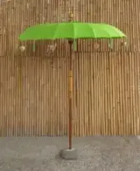 Bali umbrella, bright lime green with metal coins and golden hearts hanging around the edge, ø 190 cm and 250cm height 